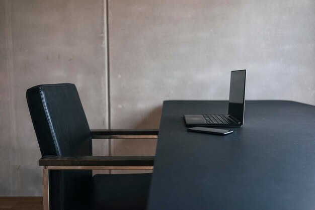 Laptop and cell phone on table