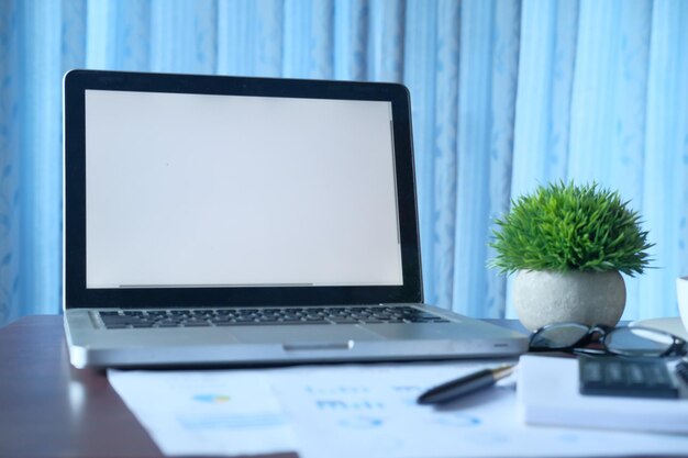 Laptop and chart on table