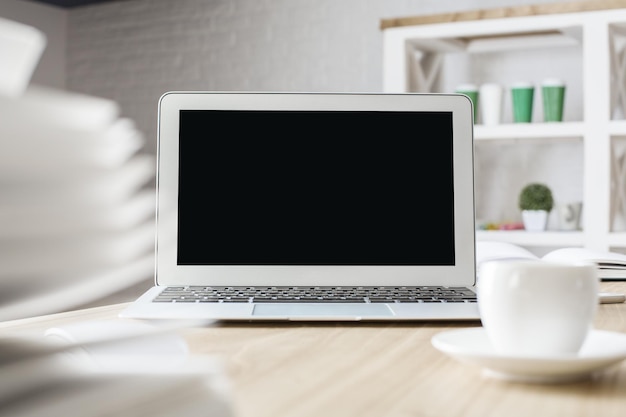 Laptop and coffee cup