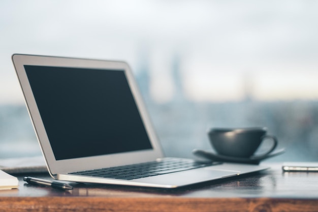 Laptop and coffee on table