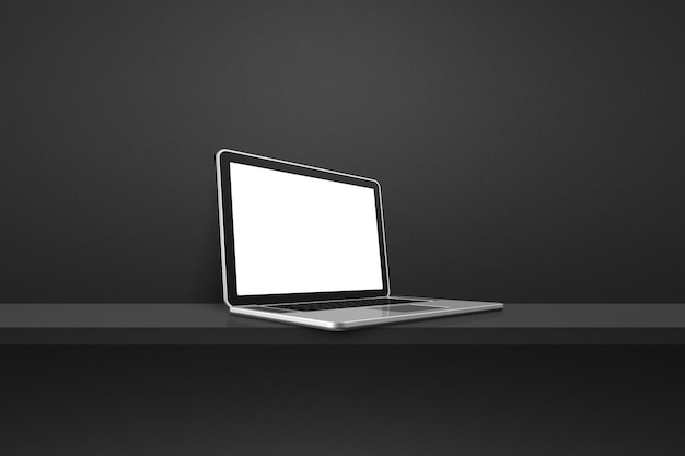 Laptop computer on black shelf background
