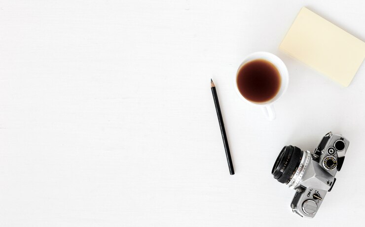 Photo laptop, computer, camera, flat composition, magazines, social media and artists. top view 