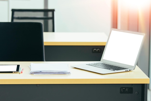 Laptop computer on desk blank screen mockup technology