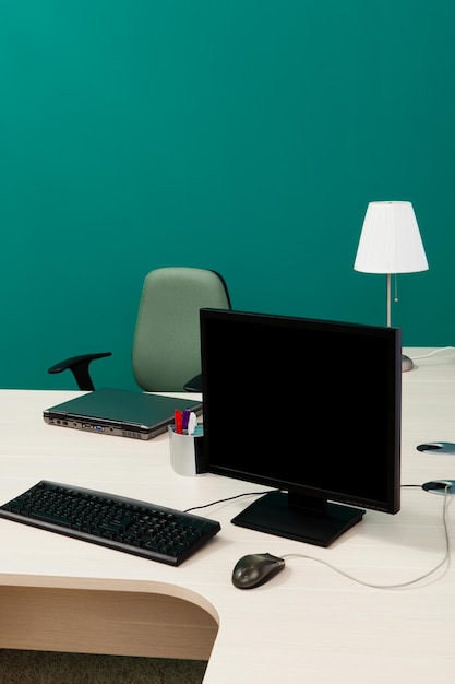 Laptop and computer on a desk