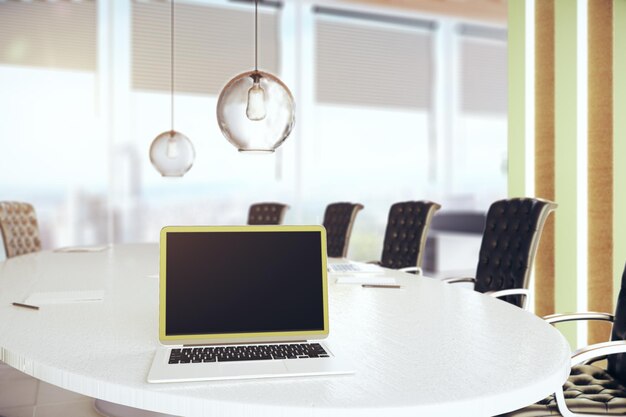 Laptop on conference table