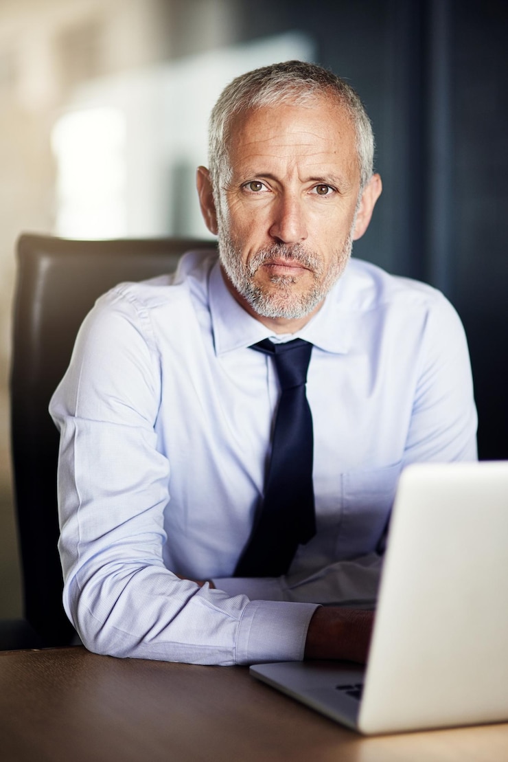Photo laptop confidence and portrait of man in office with email about us and proud director at law firm legal consultant lawyer or mature businessman at desk with computer for online project manager
