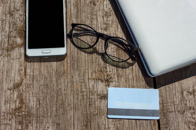 laptop and credit card are on the table