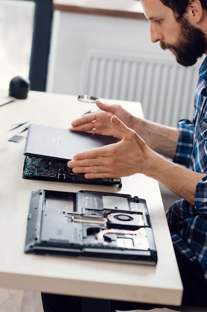 Photo laptop disassembling electronic repair shop