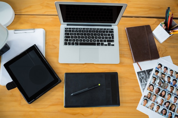 Laptop, graphic tablet and digital tablet on desk