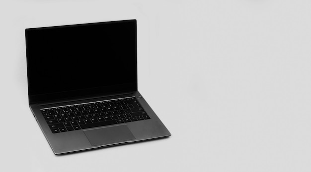 Laptop on a grey background with a copy space