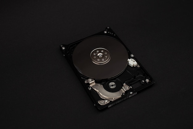 Laptop hard drive on black background