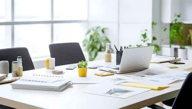 a laptop is open and on a desk with a plant in the background