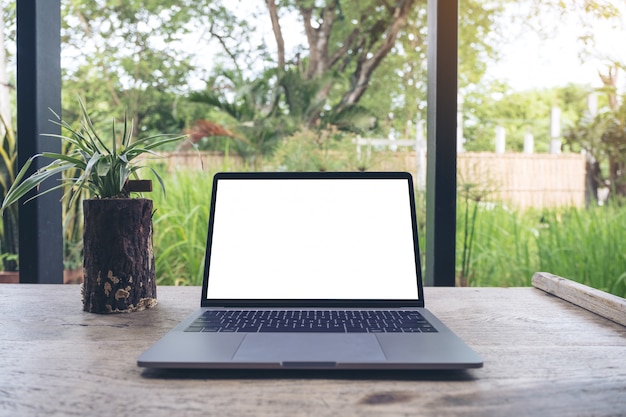 Photo a laptop is placed on vintage wooden table