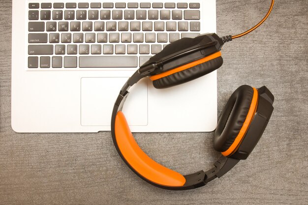 Laptop keyboard and headphones