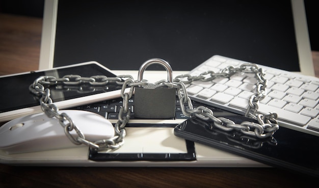 Photo laptop locked with chains and padlock