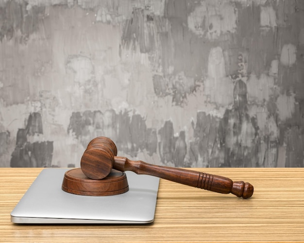 Laptop And Mallet On Table