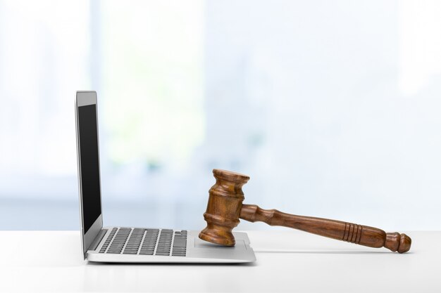 Laptop And Mallet On Table