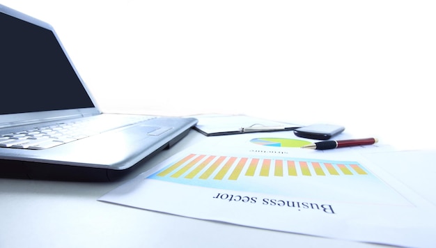 Photo laptop and a marketing scheme on the table from a businessman