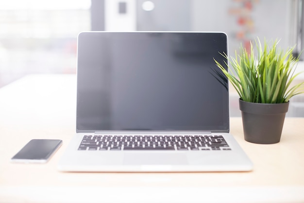 Laptop and mobile phone on a desk