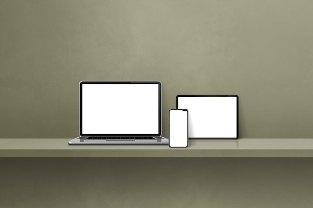 Laptop mobile phone and digital tablet pc on green wall shelf Horizontal background