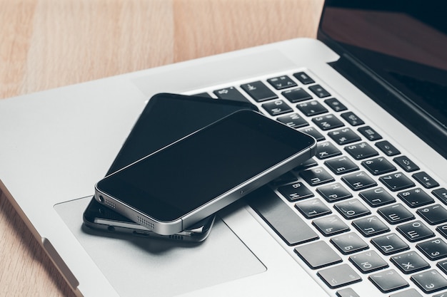 Laptop and mobile phone on the table