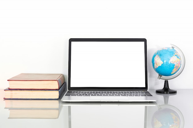 Laptop mockup and book on table