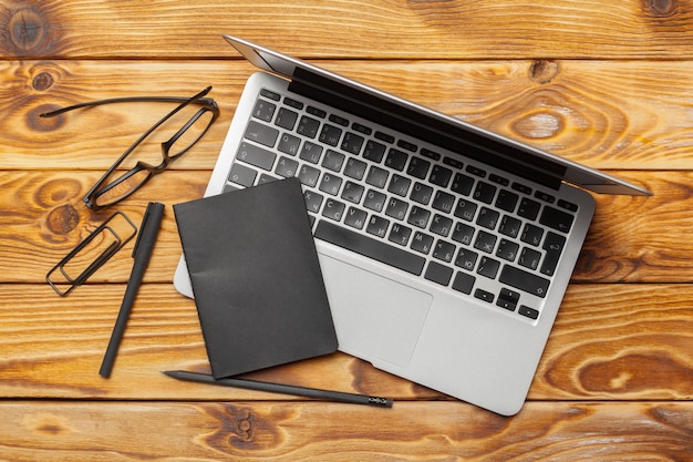 Laptop, notebook on work wooden desk