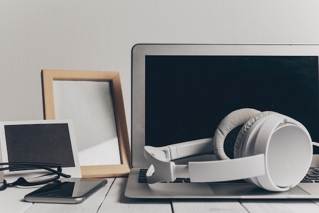 Laptop and other electronics on workspace