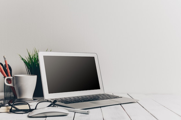 Laptop and other electronics on workspace