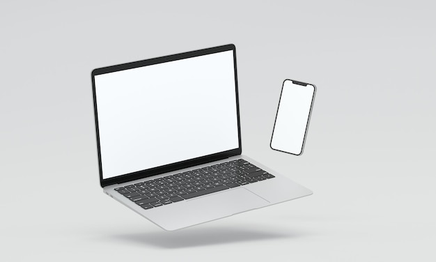 Ноутбук и телефон, плавающие в воздухе, макет
