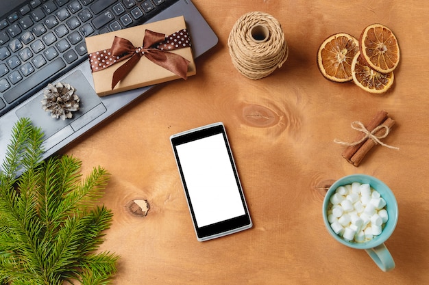 Laptop and phone with empty screen for christmas seasonal advertising