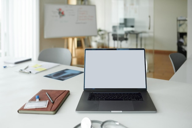 Laptop and planner on desk