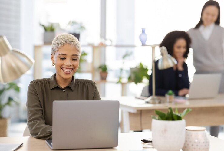 Photo laptop planning and black woman in office startup with company workflow and editing online business proposal computer email management and worker employees or project manager typing at her desk