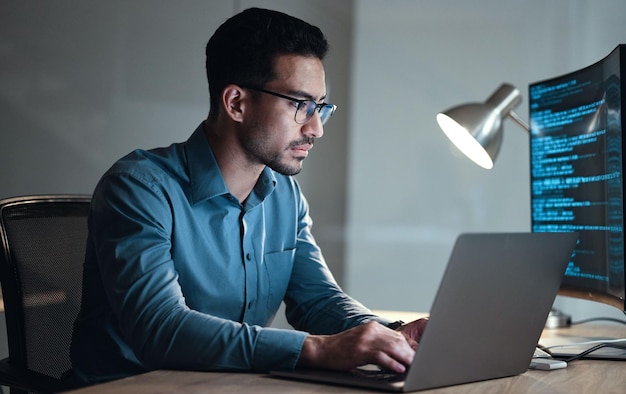 laptop screen and business man for coding software development and programming script in cybersecurity night computer research and programmer or it person with html code system or data analysis