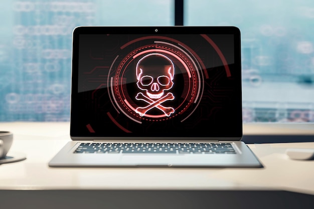 사진 사무실 나무 책상 해킹 공격 및 불법 복제 개념 3d 렌더링에 두개골과 뼈 디지털 기호가 있는 노트북 화면