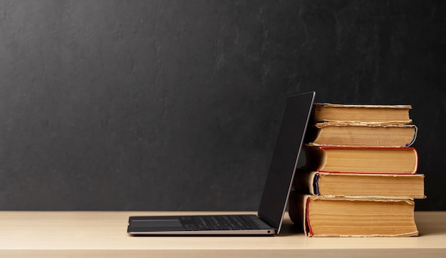 Laptop and stack of notepads