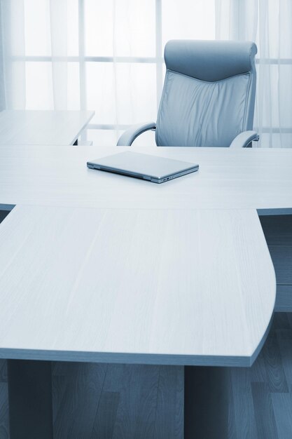 laptop on a table of director at modern office