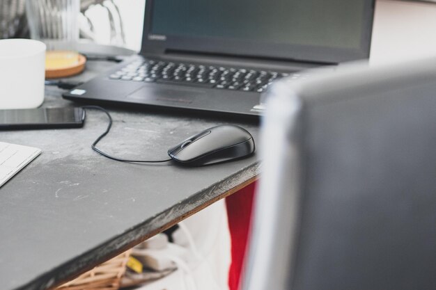 Photo laptop on table at home