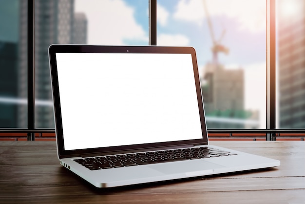 Laptop on table in office room