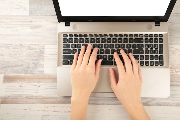 Photo laptop on table with blank screen