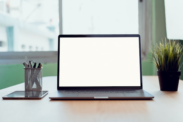 Laptop and tablet blank copy space screen. on the table in office.