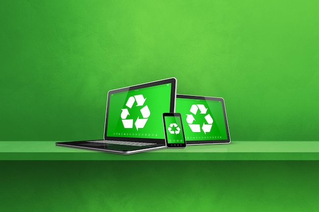 Laptop tablet PC and smartphone on a shelf with a recycle symbol on screen environmental conservation concept