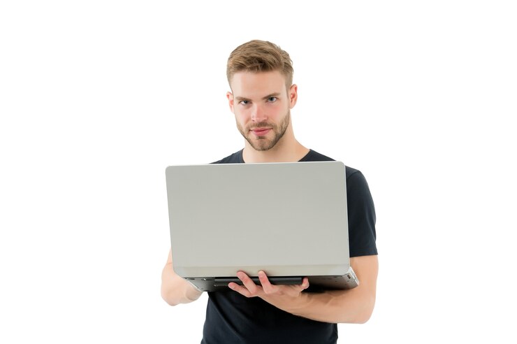 Photo laptop that is right for you. handsome man hold laptop isolated on white. professional laptop computer repairman or tech worker. notebook and pc. new technology. buy laptop computer, copy space.