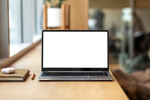 Laptop with blank screen on a desk