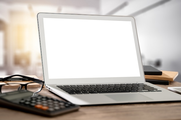 laptop with blank screen on a desk