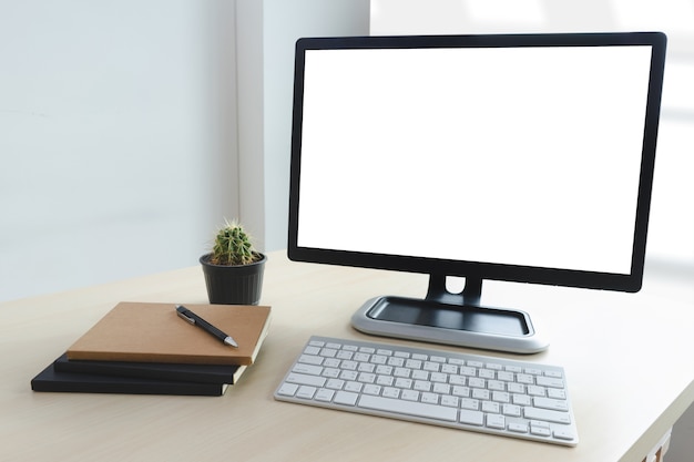 Laptop with blank screen on table