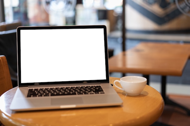 Laptop with blank screen on table