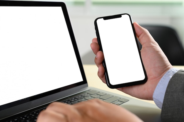 Laptop with blank screen on table