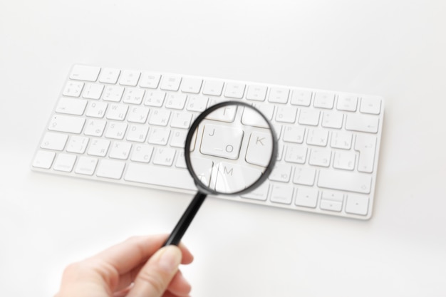 Laptop with a magnifying glass