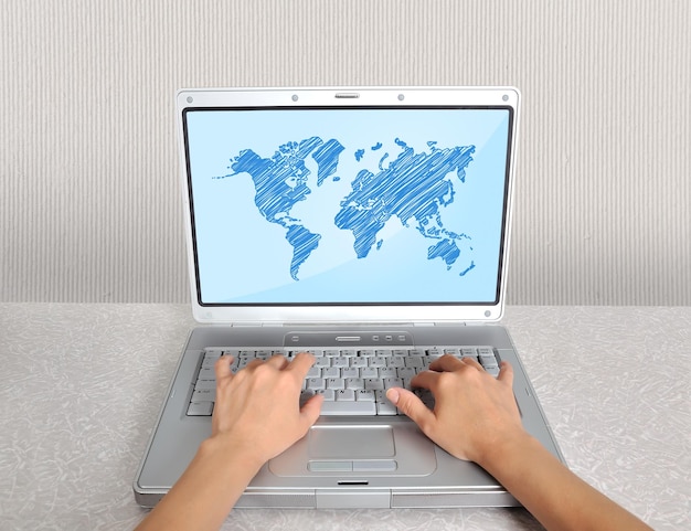 Photo laptop with world map